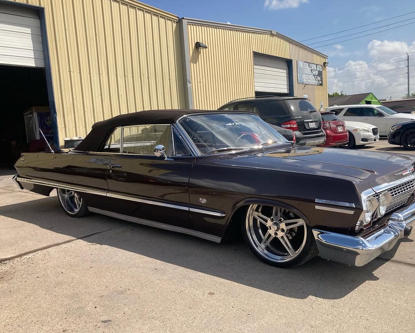Classic Chevrolet Impala convertible with fresh dark paint outside INC Collision