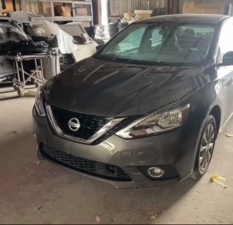 Gray Nissan Sentra after front-end collision repair at INC Collision